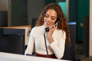 A member of Airmid staff answering the phone. palliative care, home care services